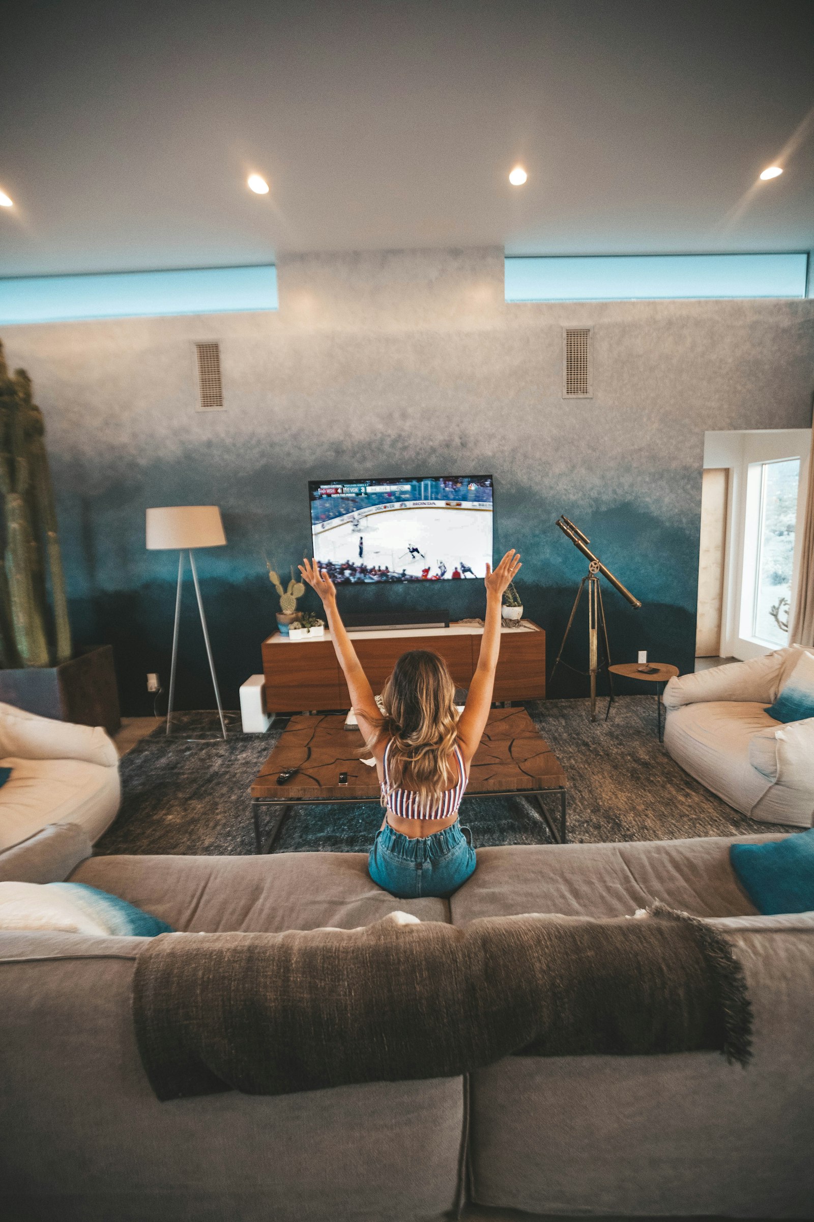 A viewer engaged with content on a Connected TV in the living room